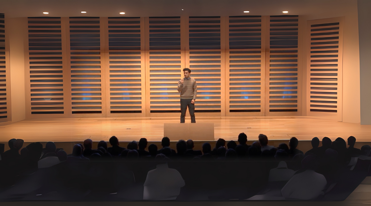 Rafie Faruq speaking at a conference about consciousness and technology